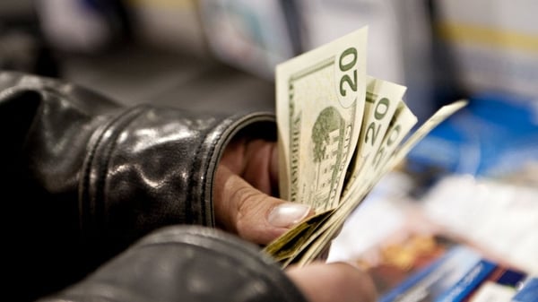 The dollar sank to a three-year low yesterday