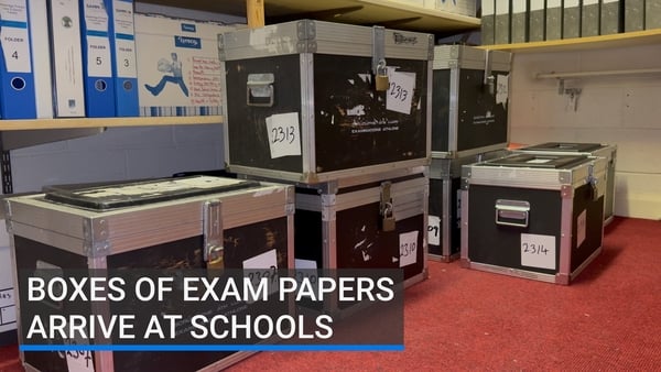 Heavy boxes filled with exam papers are ready to go for tomorrow