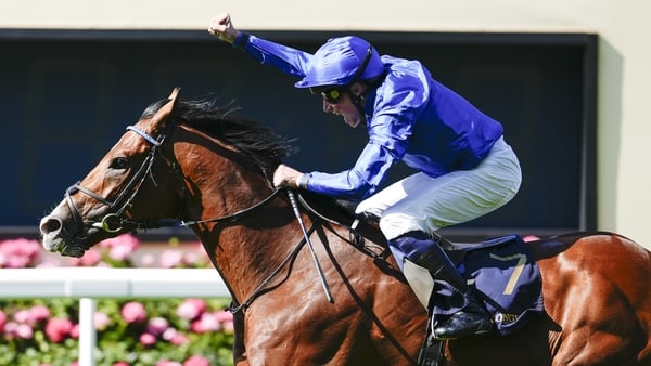 William Buick punches the air after the lightly raced Ombudsman scores on his first try in Group One company