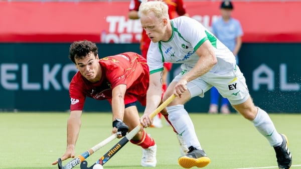 Peter Brown of Ireland battles for the ball with Xavier Gispert of Spain
