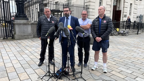 Niall McKenna speaking to reporters outside the courthouse