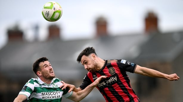 23 June 2025; Jordan Flores of Bohemians in action against Aaron Greene of Shamrock Rovers during the SSE Airtricity Men's Premier Division match between Bohemians and Shamrock Rovers at Dalymount Park in Dublin. Photo by Ramsey Cardy/Sportsfile
